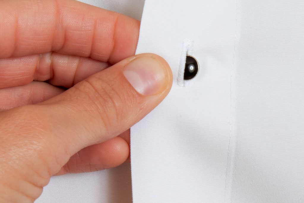 push stud through buttonhole