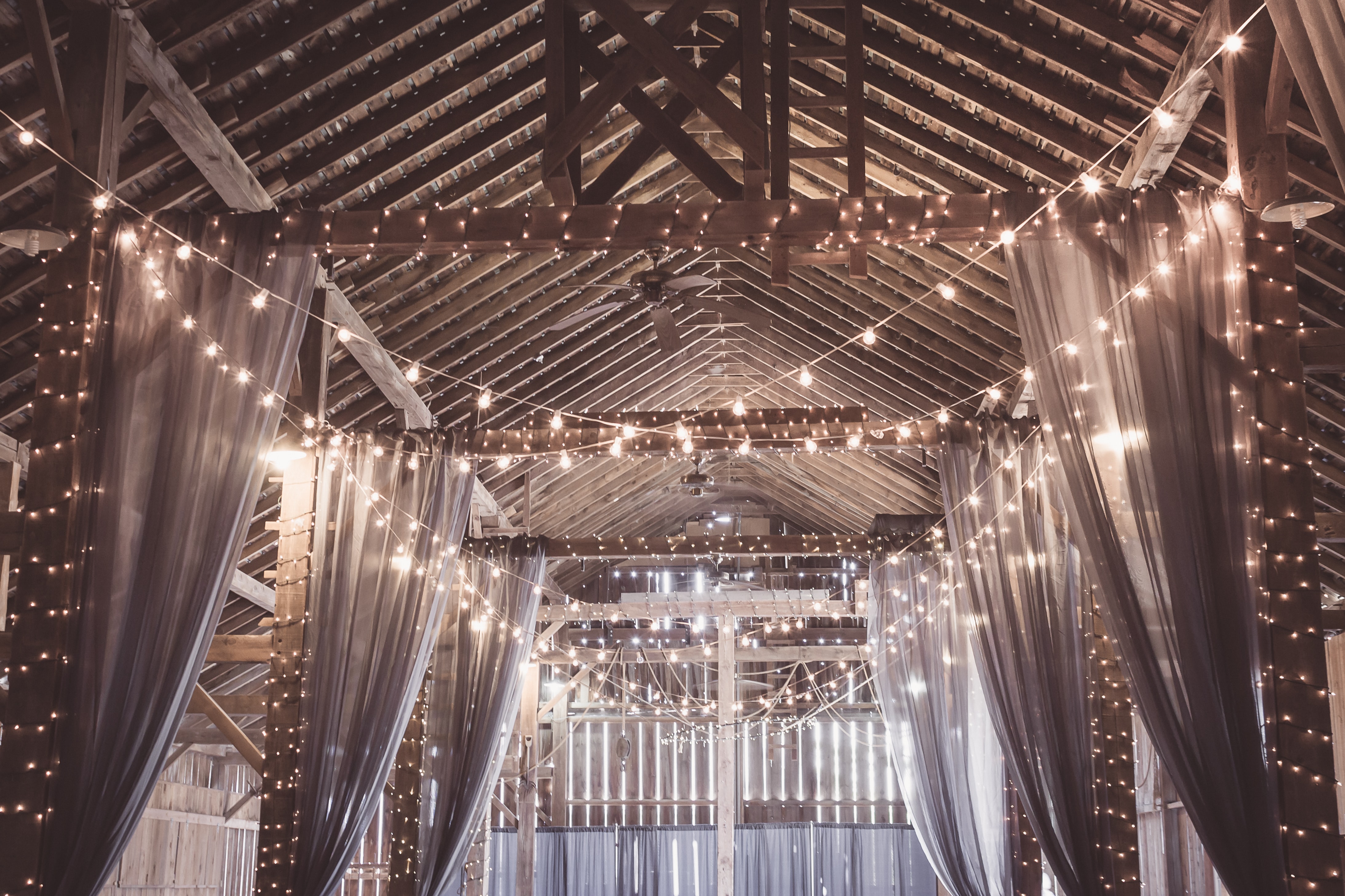 trends for weddings in 2021 - a bunch of string lights inside a venue